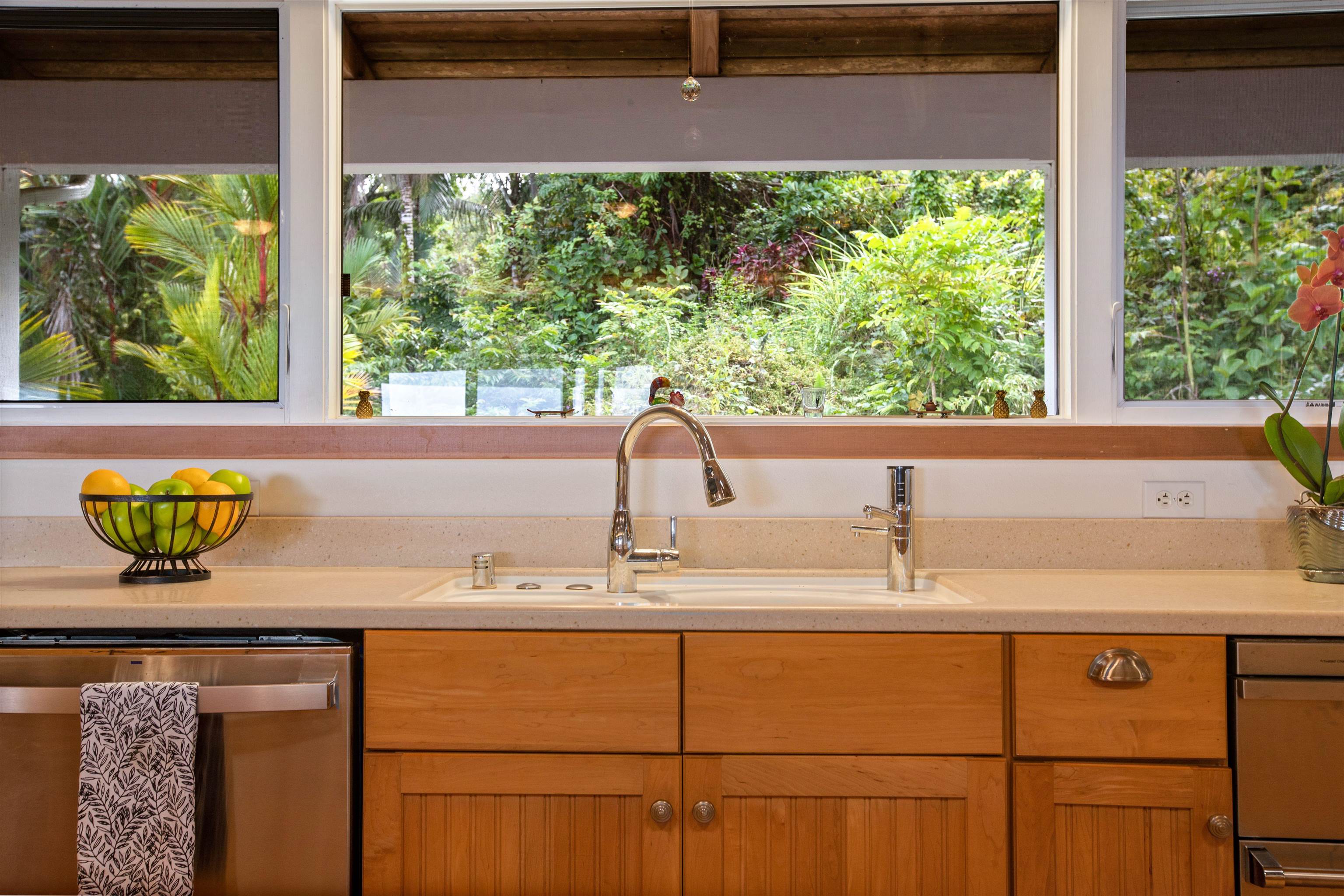 285 Kalo Road Hana, HI 96713 - Photo 9 of 36 a bathroom with a granite countertop sink and a window