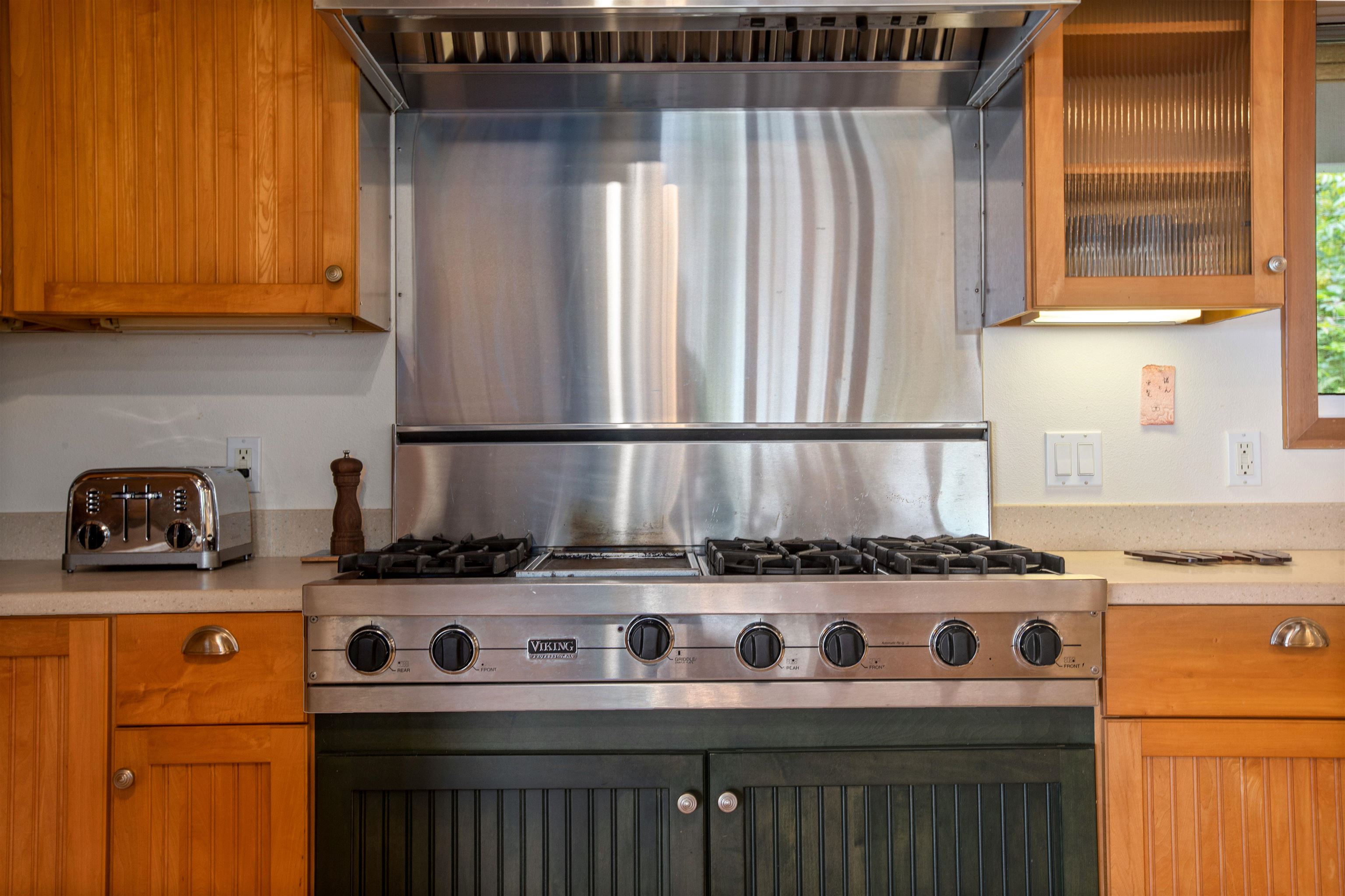 285 Kalo Road Hana, HI 96713 - Photo 10 of 36 a close view of a stove top oven sitting inside of a kitchen