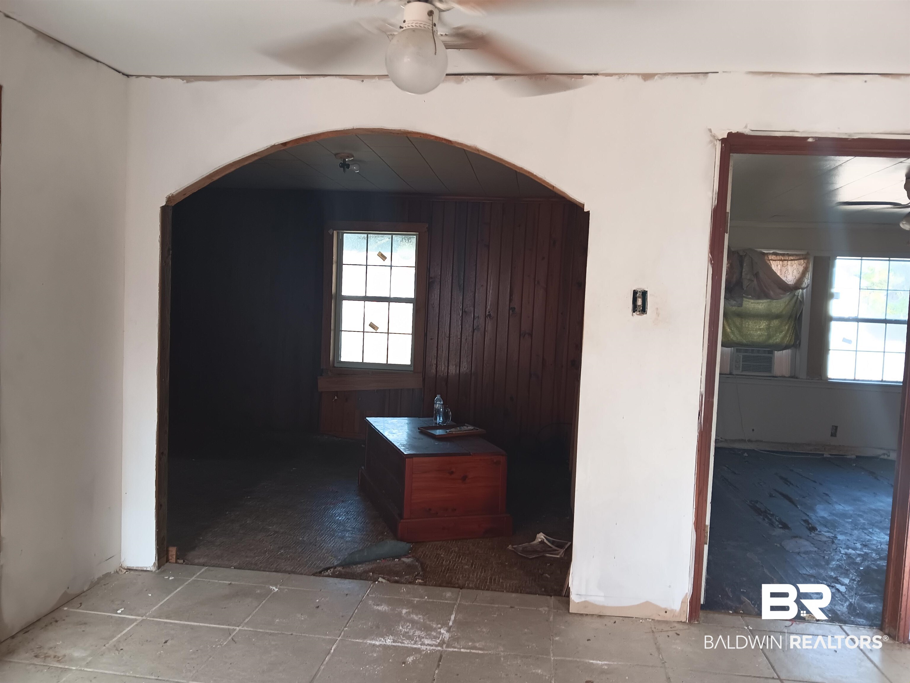 61 Katherine Street Flomaton, AL 36441 - Photo 4 of 13 Hallway with cooling unit and wooden walls