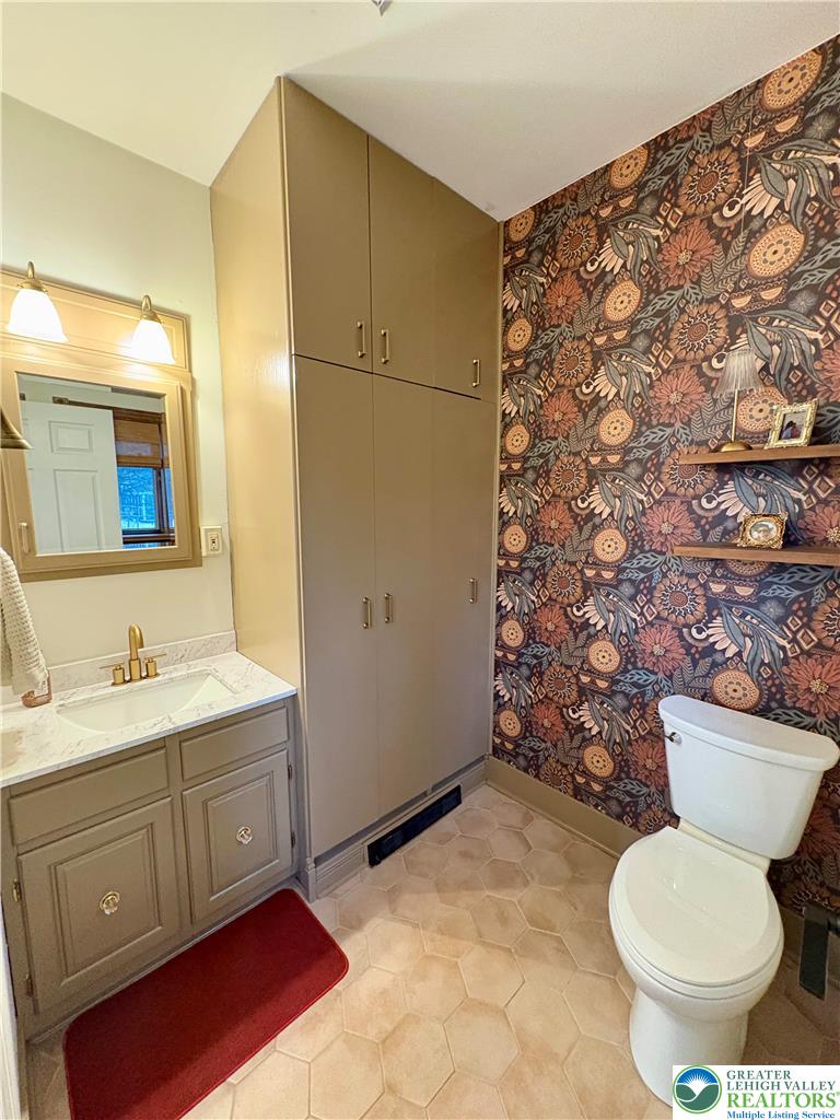 375 Georgetown Road Nazareth, PA 18064 - Photo 14 of 21 a bathroom with a toilet sink and mirror