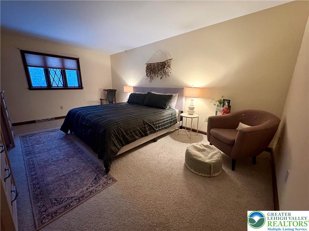 375 Georgetown Road Nazareth, PA 18064 - Photo 19 of 21 a spacious bedroom with a bed and a couch