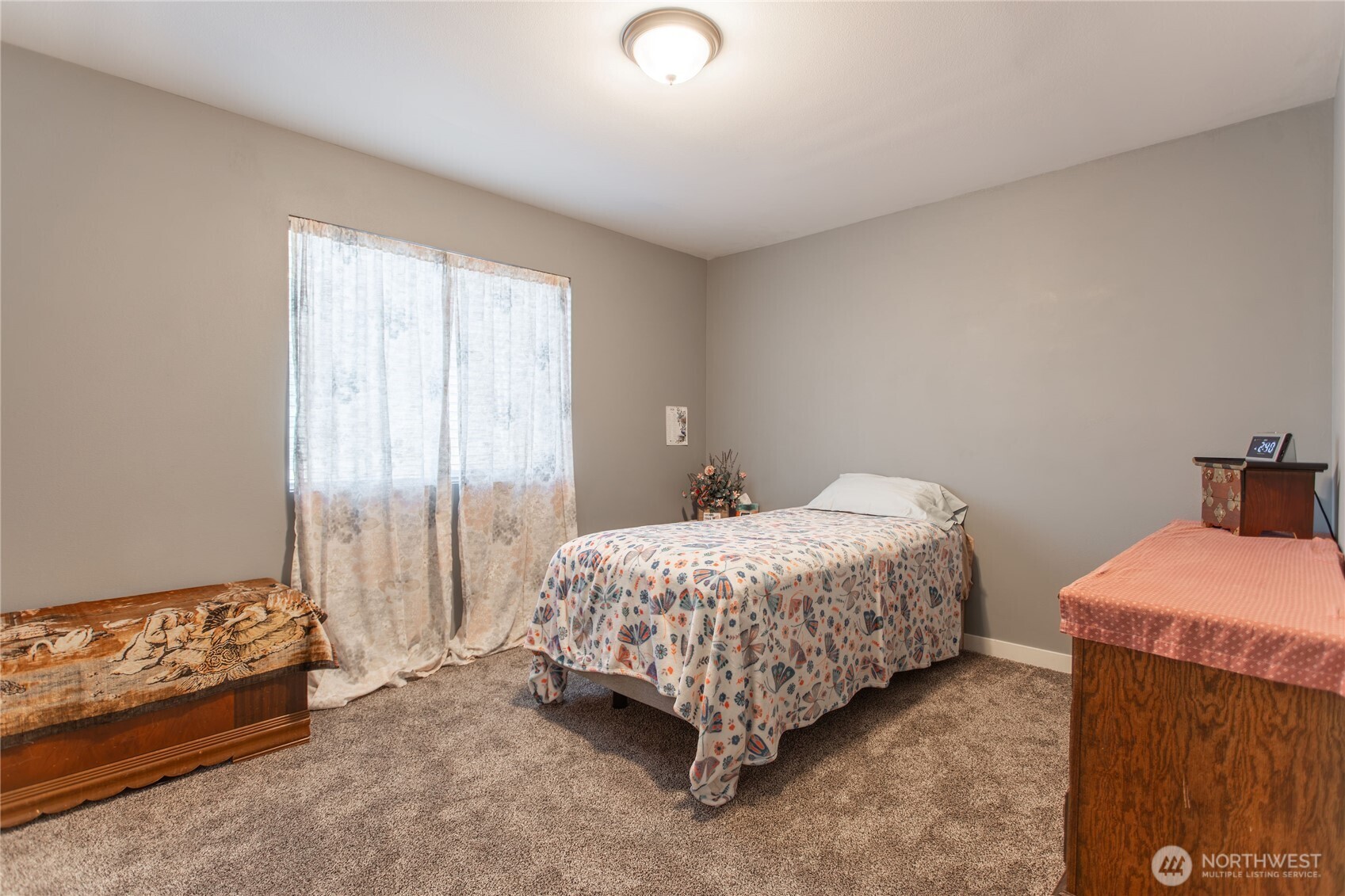 2915 Jackson Highway, Unit D Chehalis, WA 98532 - Photo 11 of 24 a bedroom with a bed and a window