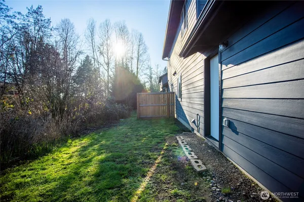 a backyard of a house with lots of green space
