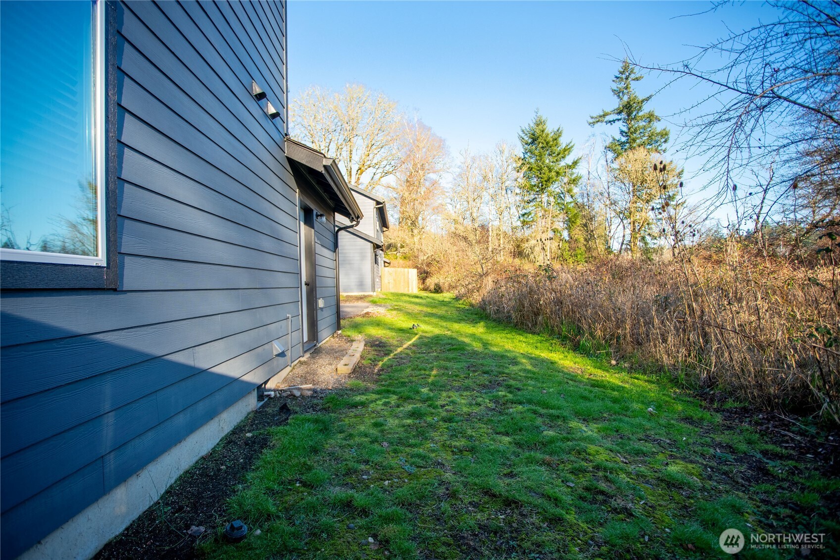2915 Jackson Highway, Unit D Chehalis, WA 98532 - Photo 19 of 24 a backyard of a house with lots of green space