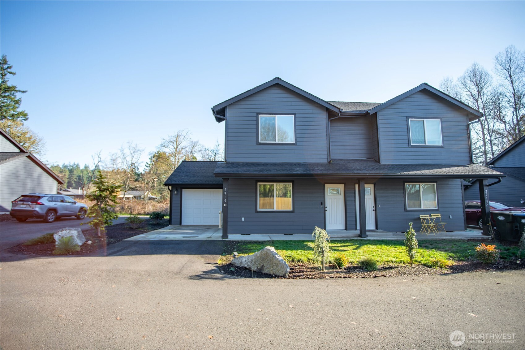 2915 Jackson Highway, Unit D Chehalis, WA 98532 - Photo 2 of 24 a front view of a house with a garden and yard