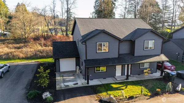 an aerial view of houses with yard