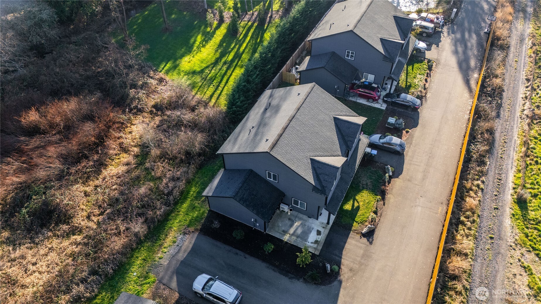 2915 Jackson Highway, Unit D Chehalis, WA 98532 - Photo 24 of 24 an aerial view of houses with yard