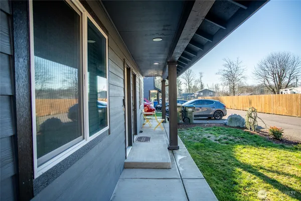 a view of a porch in front of house with a yard