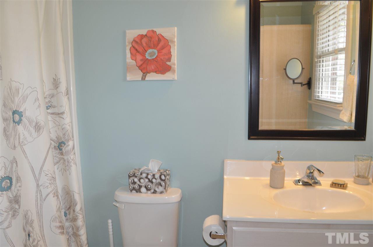 720 Parkham Lane Raleigh, NC 27603 - Photo 13 of 23 a bathroom with a sink mirror and toilet