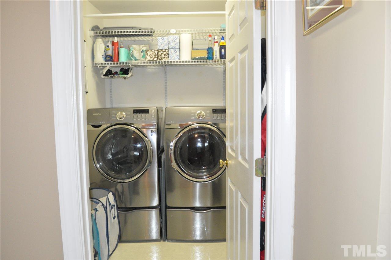 720 Parkham Lane Raleigh, NC 27603 - Photo 15 of 23 a close view of a utility room with washer and dryer
