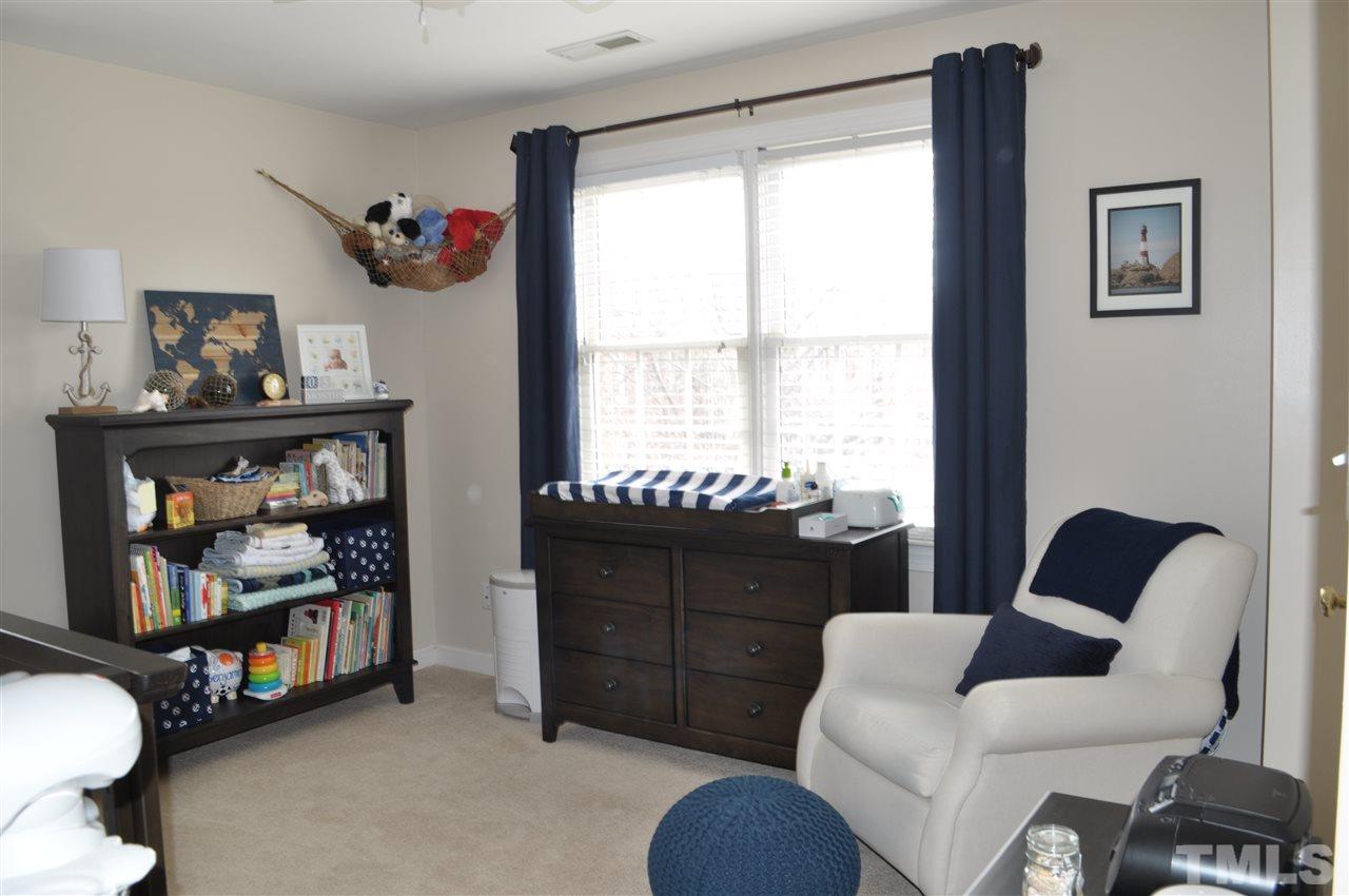 720 Parkham Lane Raleigh, NC 27603 - Photo 16 of 23 a living room with furniture and a window