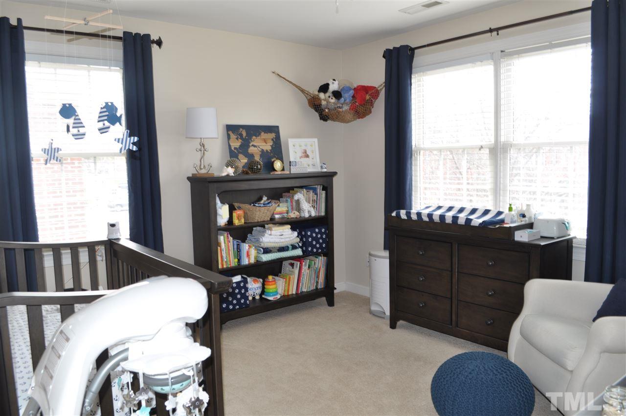 720 Parkham Lane Raleigh, NC 27603 - Photo 17 of 23 a bedroom with furniture and a window
