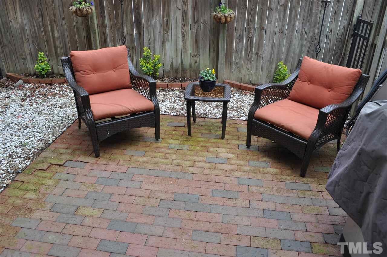 720 Parkham Lane Raleigh, NC 27603 - Photo 22 of 23 a backyard of a house with outdoor seating