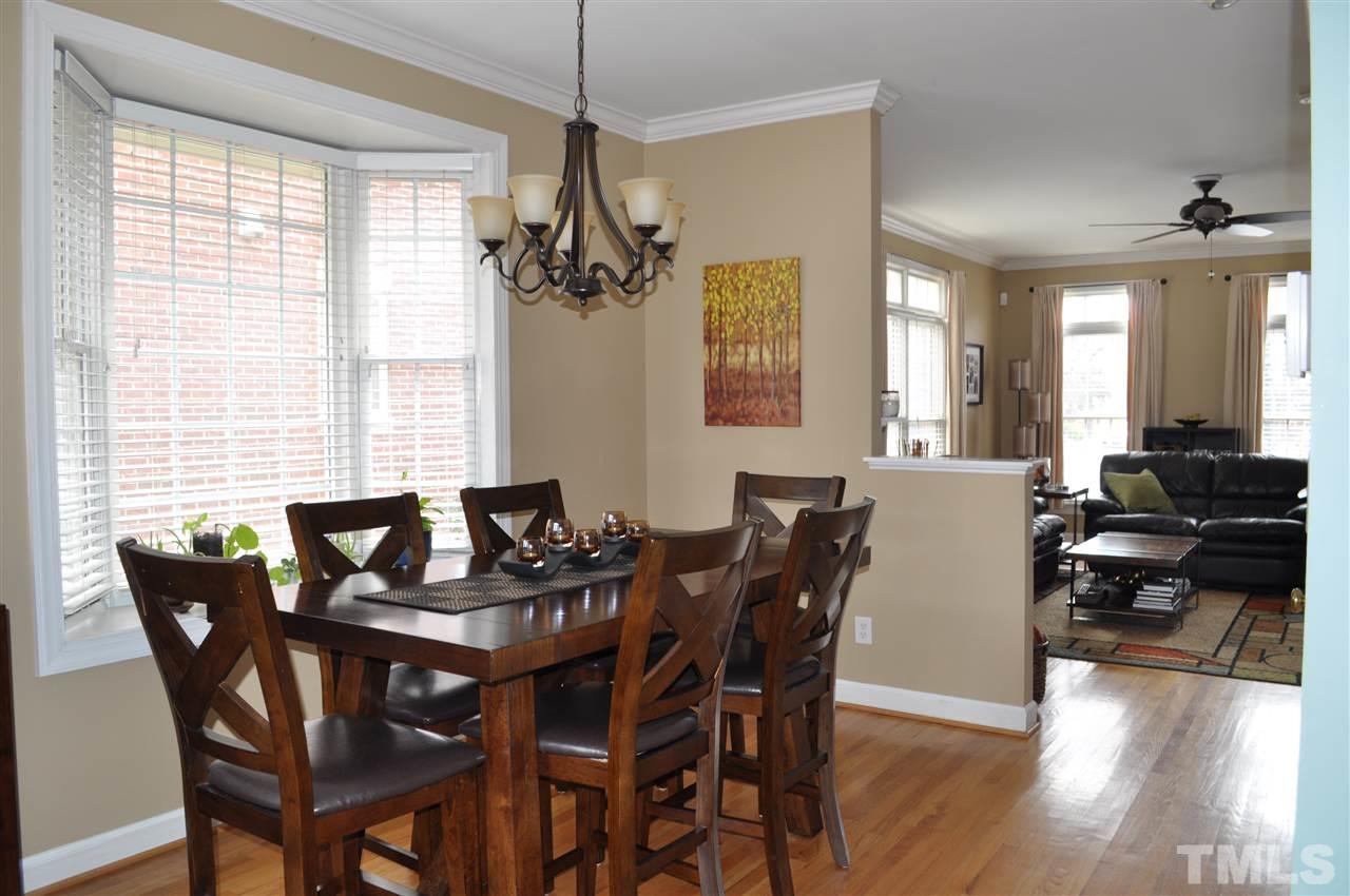 720 Parkham Lane Raleigh, NC 27603 - Photo 7 of 23 a view of a dining room with furniture window and wooden floor