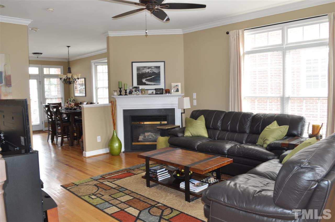 720 Parkham Lane Raleigh, NC 27603 - Photo 9 of 23 a living room with furniture and a fireplace
