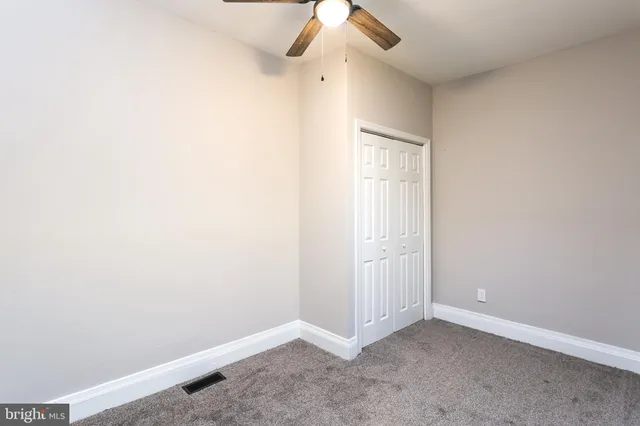 an empty room with a empty space and a window