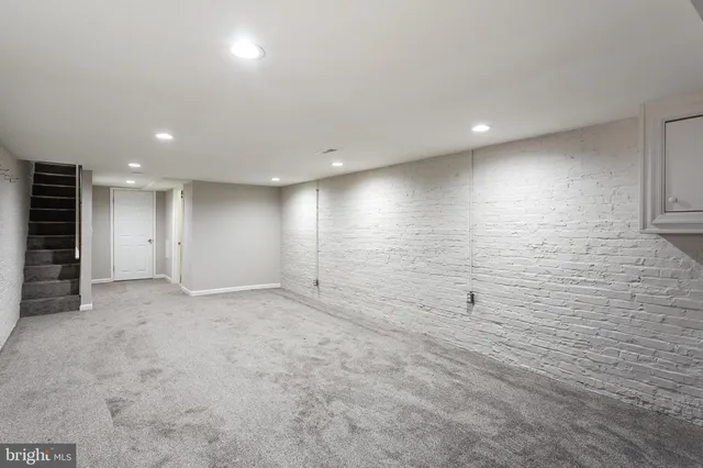 a bathroom with a sink a toilet and bathtub