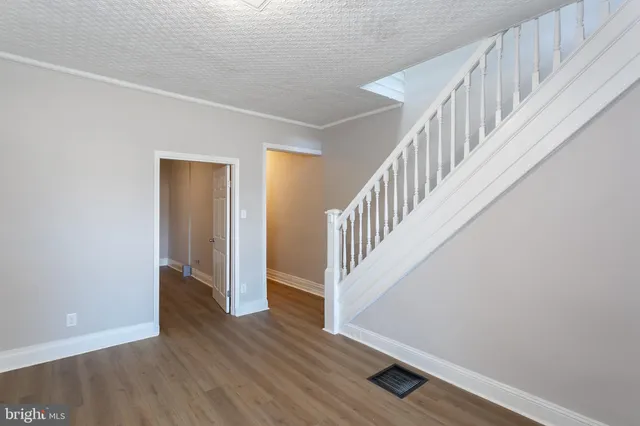 a view of entryway with wooden floor