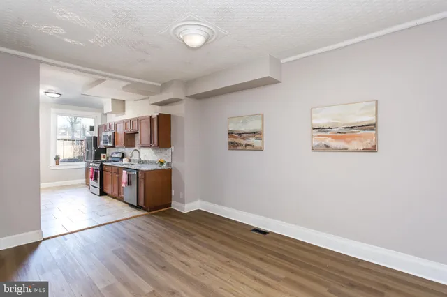 a view of kitchen with wooden floor