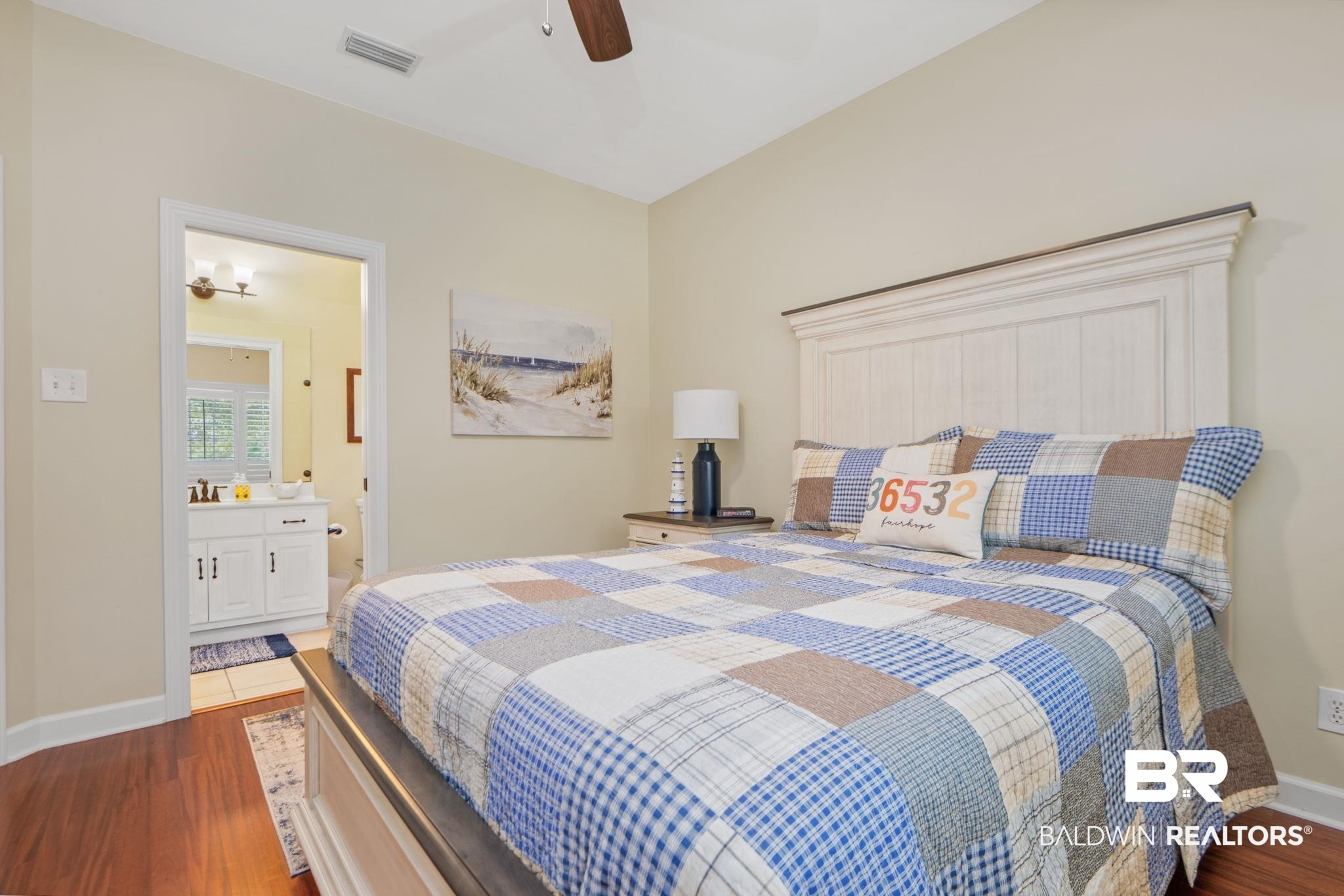 105 Beaver Dam Road Fairhope, AL 36532 - Photo 25 of 55 Bedroom with hardwood / wood-style flooring, ensuite bathroom, and ceiling fan