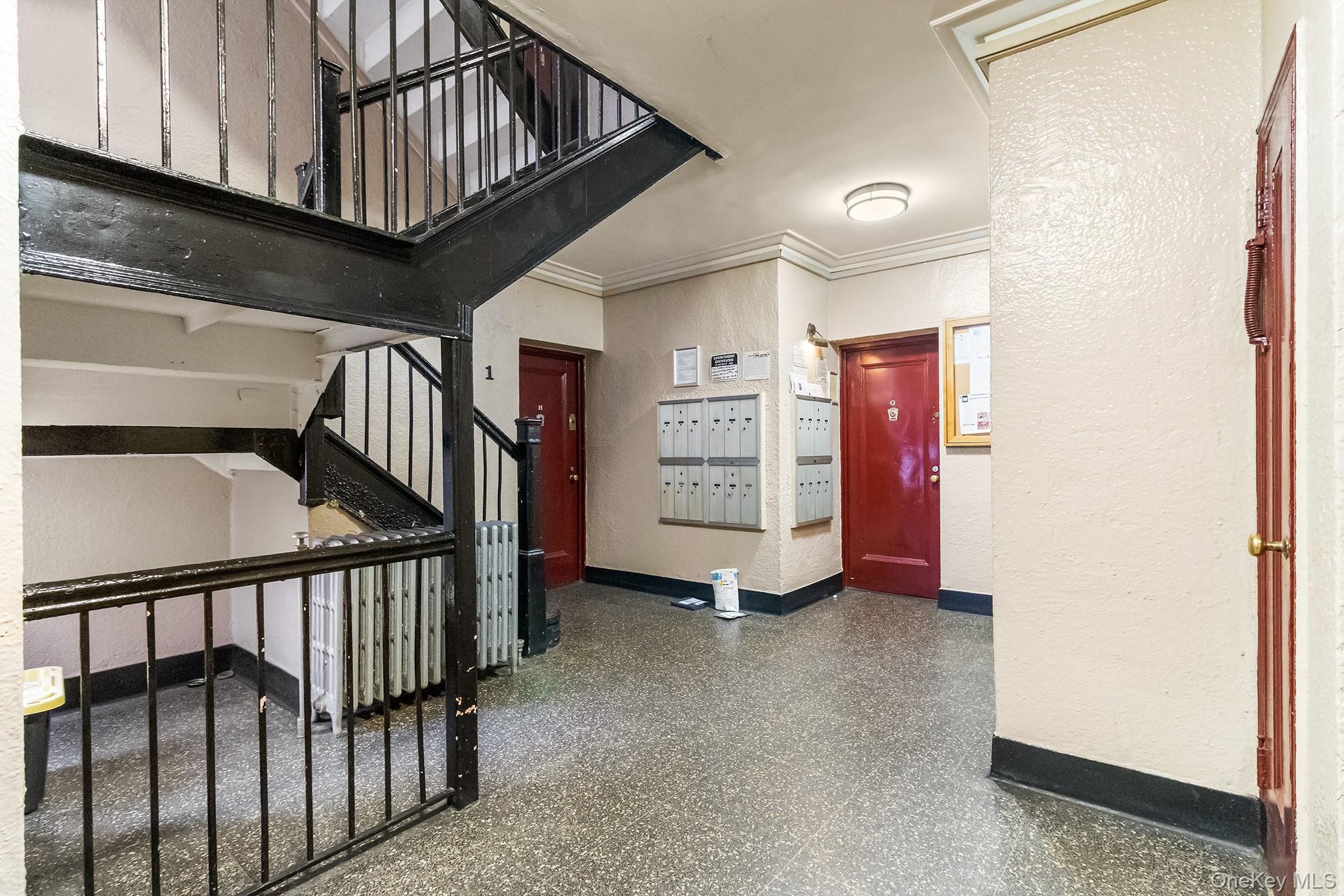 43-10 48th Avenue, Unit 2F Queens, NY 11377 - Photo 13 of 14 a view of an entryway with staircase