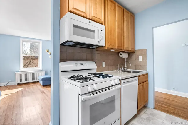 a kitchen with a stove and a microwave