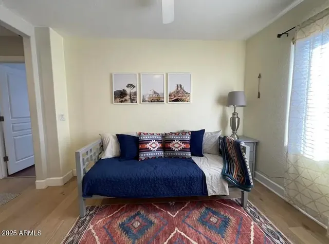 a living room with furniture rug and window