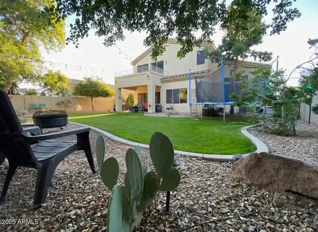 a front view of a house with garden and patio