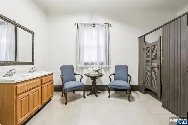 a bedroom with a bed and a table