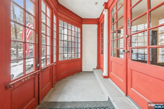 a room with a bed and wooden floor