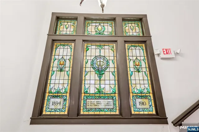 a view of a living room and entryway