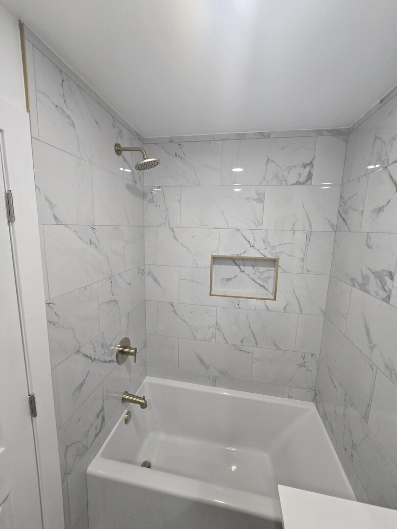 9727 South Michigan Avenue Chicago, IL 60628 - Photo 12 of 24 a bathroom with a bathtub