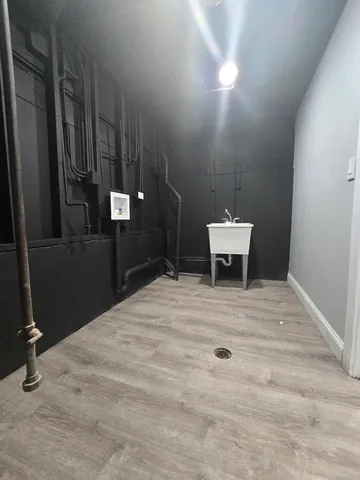 a brick building with a bench in front of it