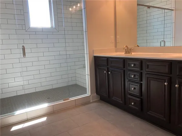 a bathroom with a sink and a shower