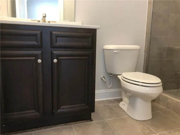 a bathroom with a toilet and a sink
