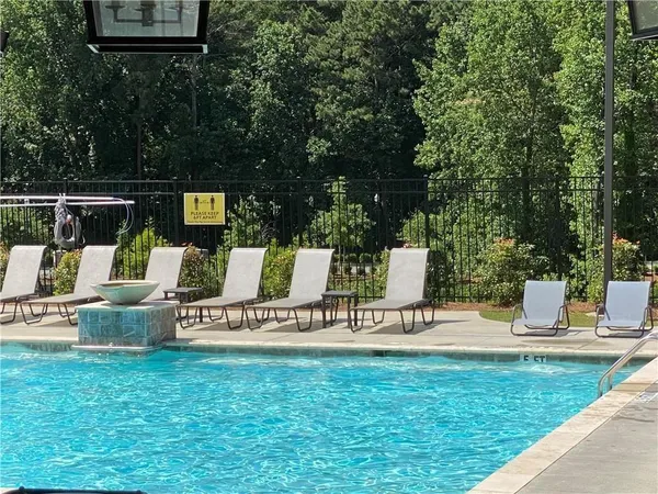 a view of table and chair in the back yard