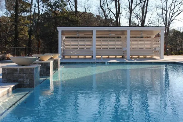 a view of a two chairs in the patio
