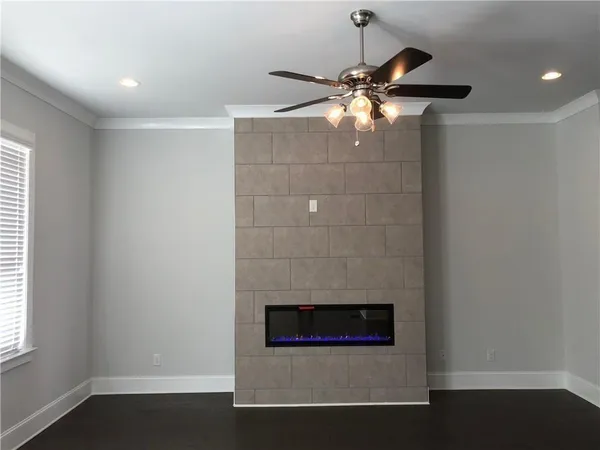 a room with fireplace and fan