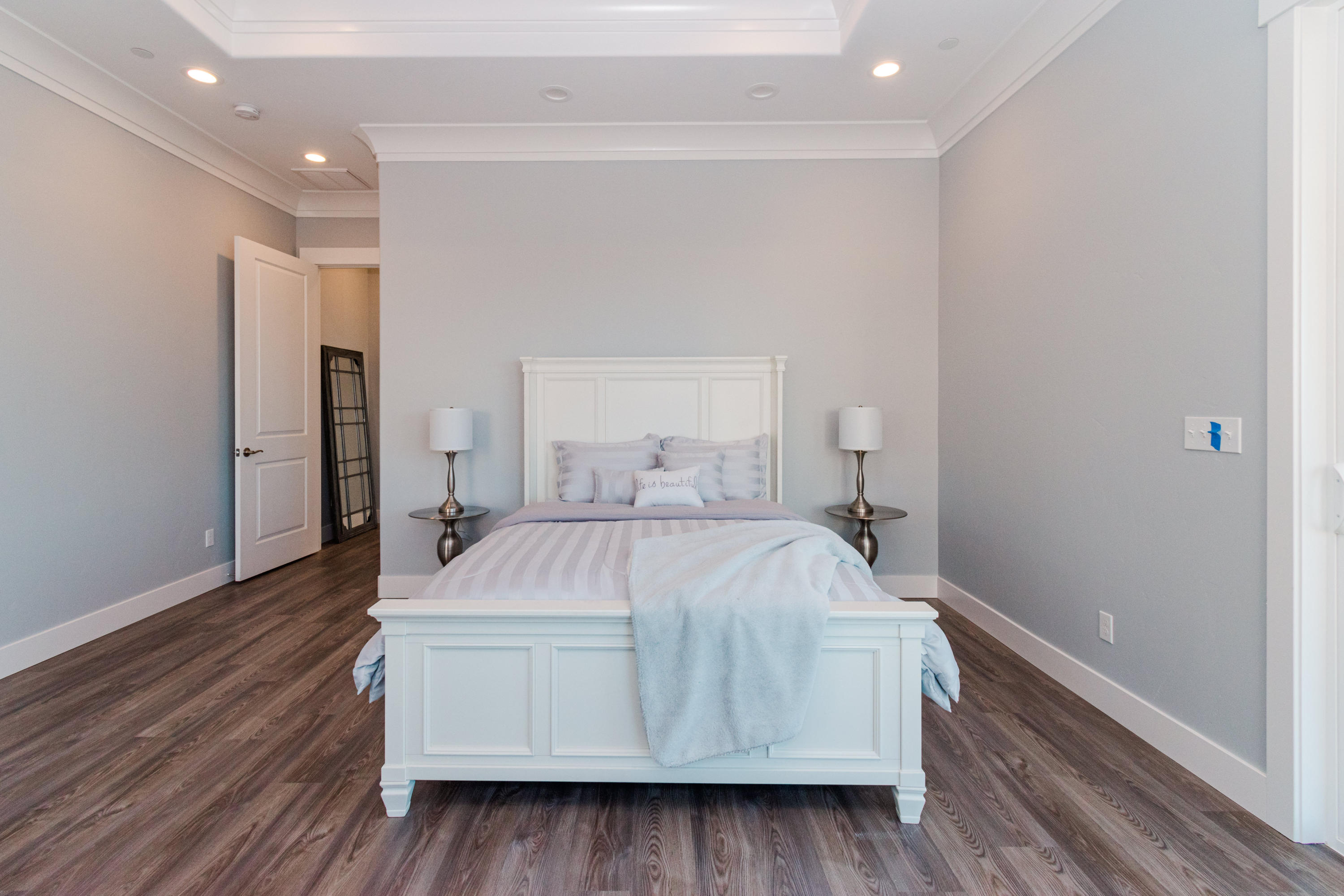 808 River Bend Road Redding, CA 96003 - Photo 18 of 43 a room with a bed and wooden floor