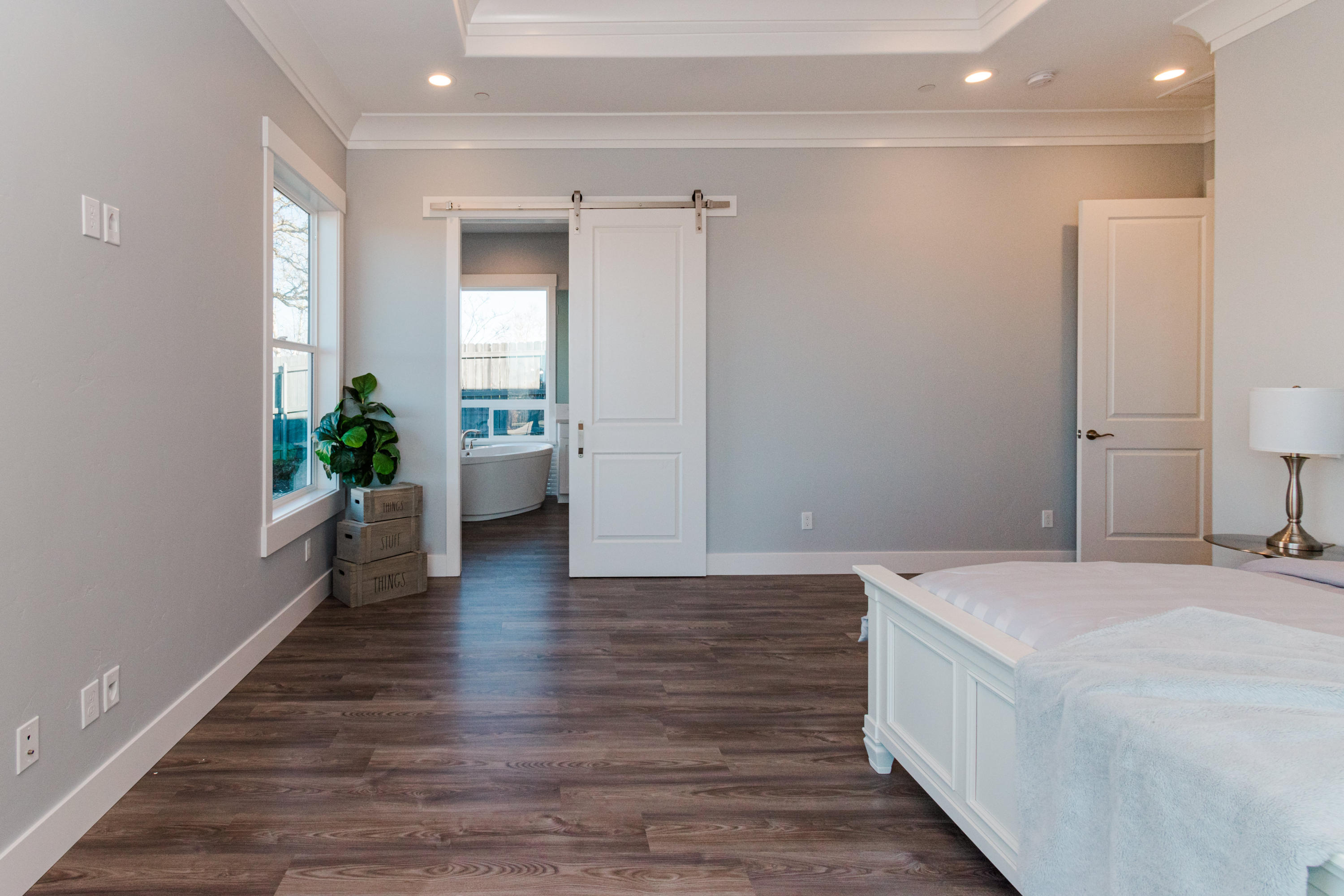 808 River Bend Road Redding, CA 96003 - Photo 19 of 43 a room with a bed and a wooden floor