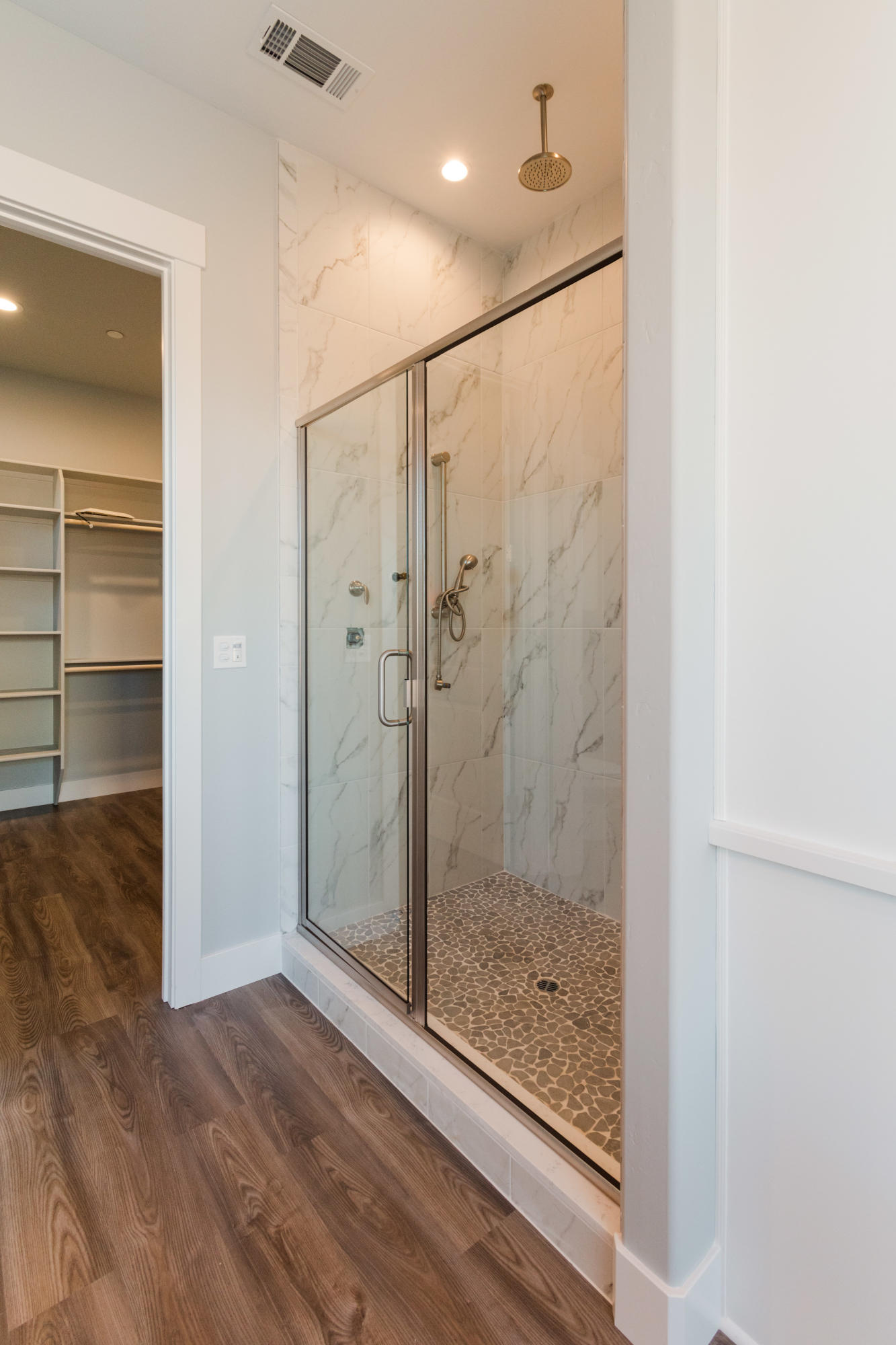 808 River Bend Road Redding, CA 96003 - Photo 23 of 43 a bathroom with a glass shower door