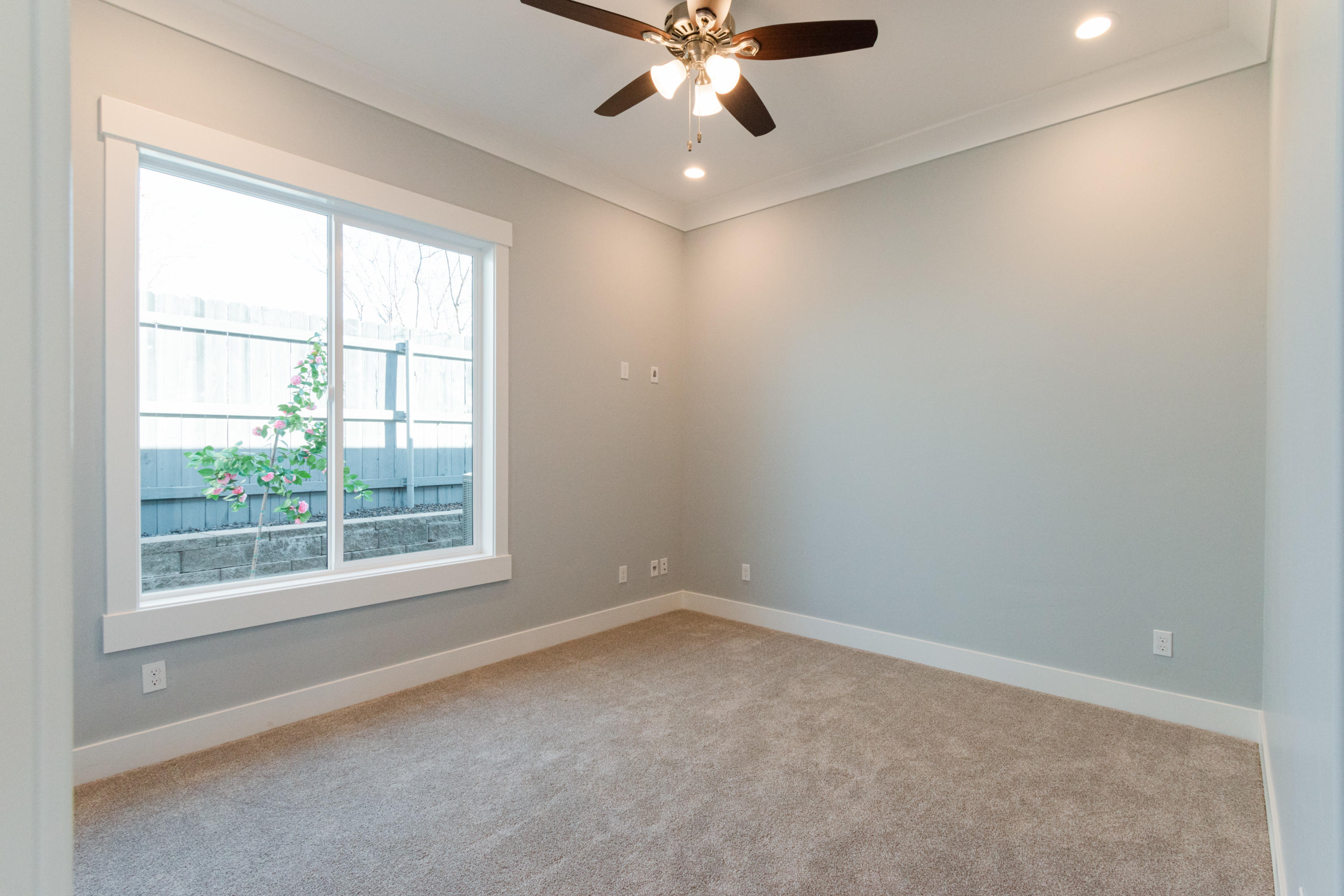808 River Bend Road Redding, CA 96003 - Photo 28 of 43 an empty room with a window and a fan