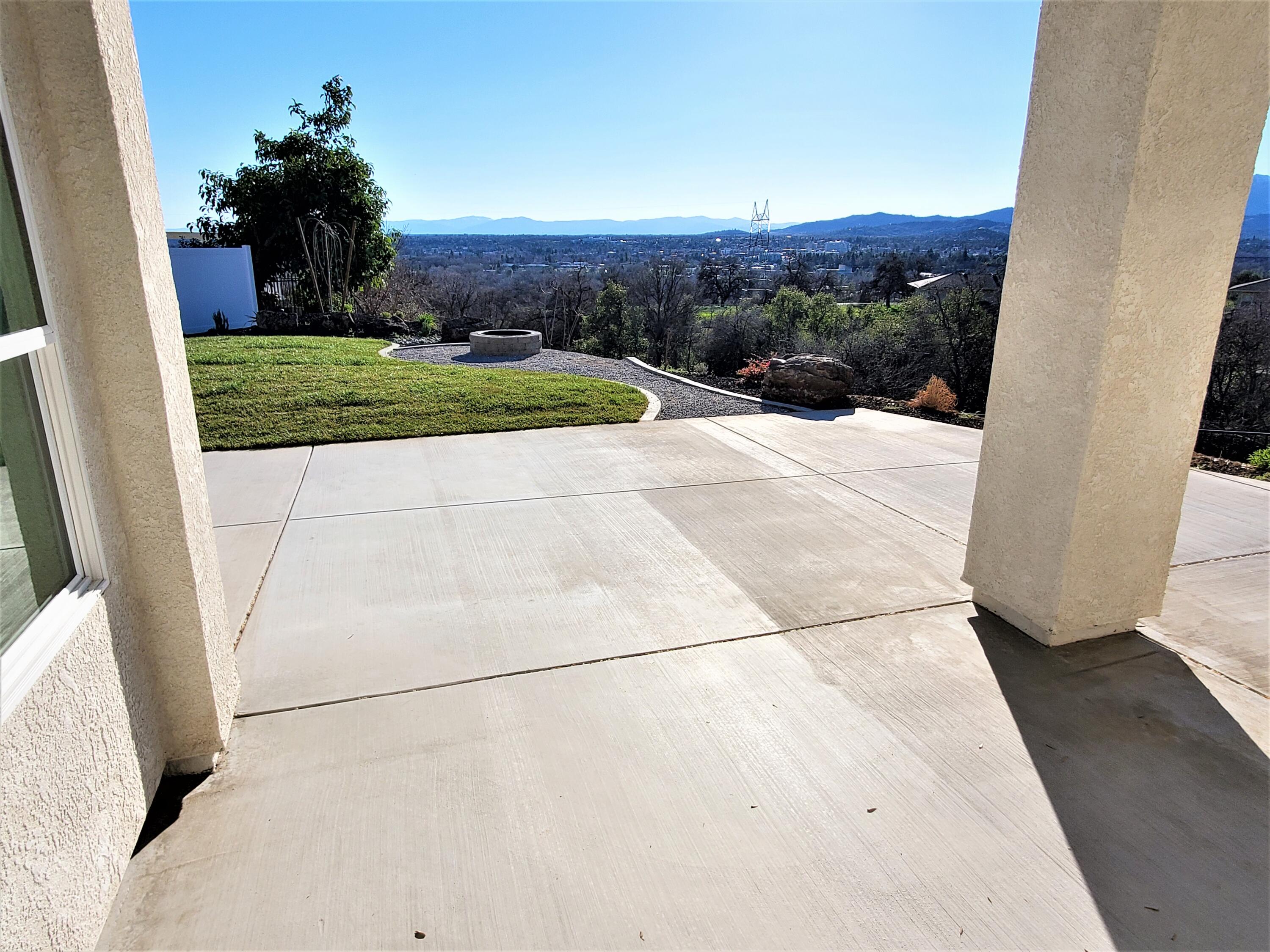 808 River Bend Road Redding, CA 96003 - Photo 32 of 43 a view of a yard with an outdoor space