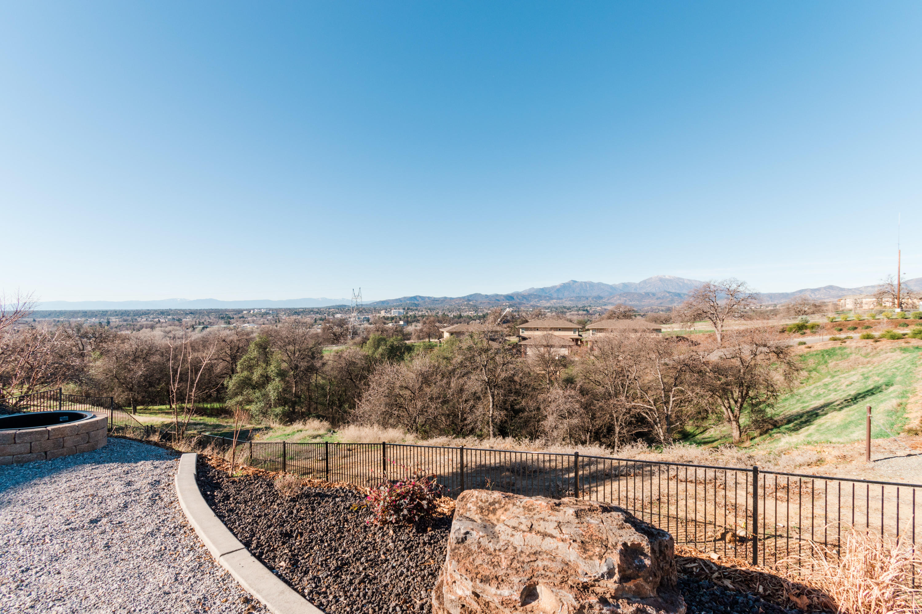 808 River Bend Road Redding, CA 96003 - Photo 34 of 43 a view of a terrace with a bench