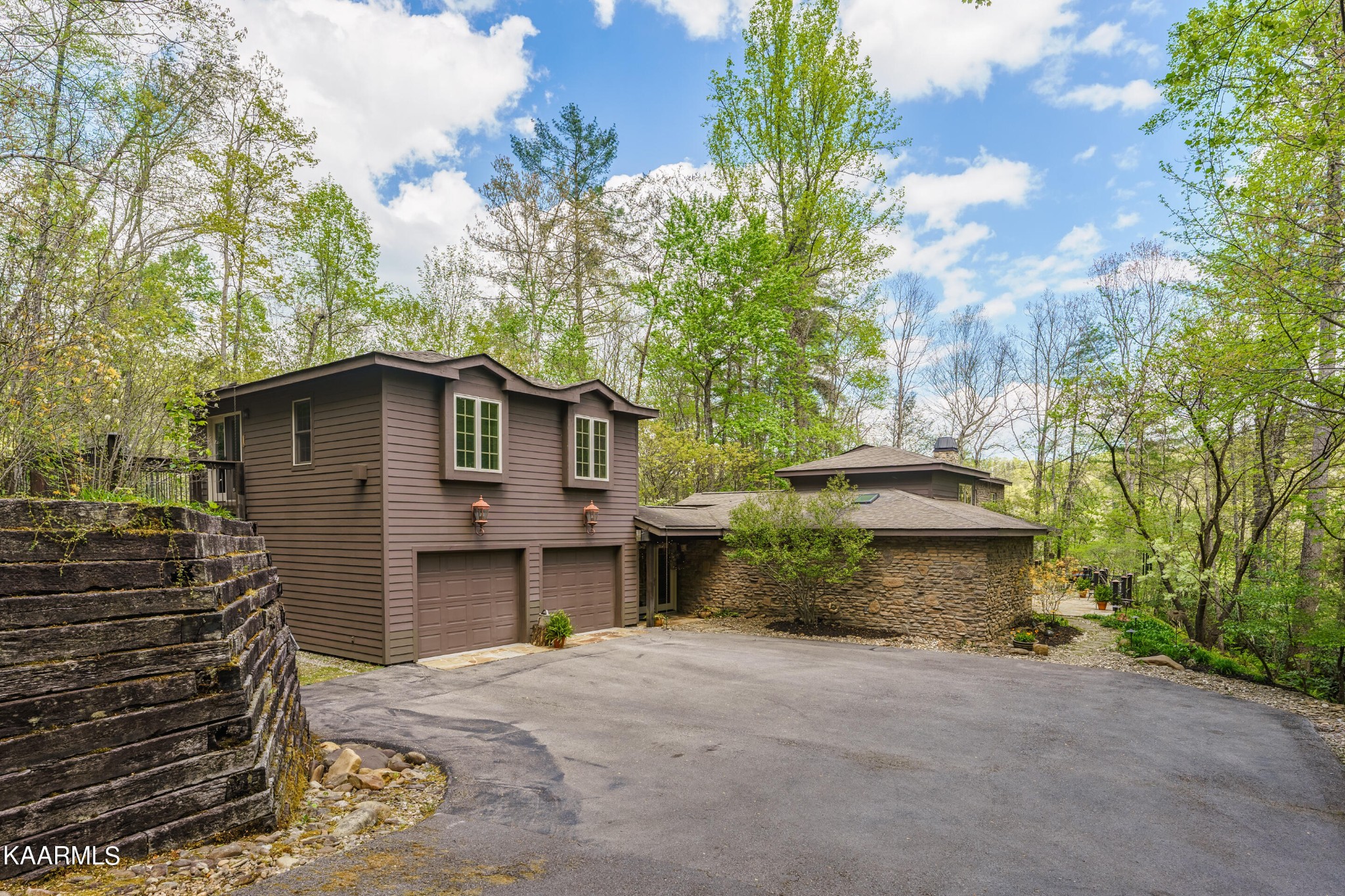 4614 Whetstone Road Sevierville, TN 37862 - Photo 1 of 60 a front view of a house with a garden