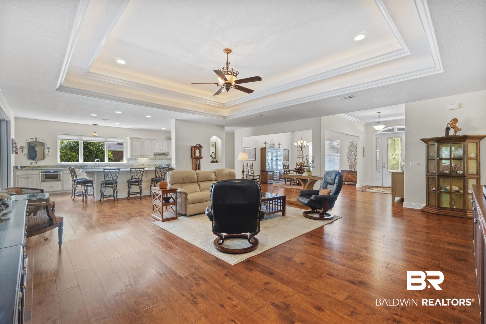 8664 Foxtail Loop Pensacola, FL 32526 - Photo 9 of 64 Living area featuring a tray ceiling, ceiling fan, hardwood / wood-style floors, recessed lighting, and ornamental molding