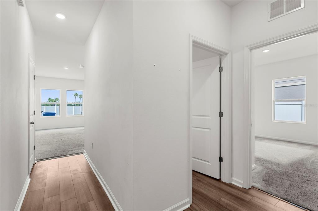 1038 Kelly Fern Loop Ruskin, FL 33570 - Photo 13 of 34 a view of hallway with wooden floor