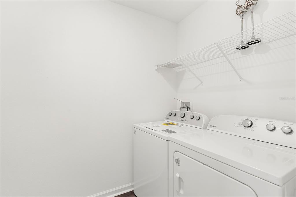 1038 Kelly Fern Loop Ruskin, FL 33570 - Photo 29 of 34 a utility room with dryer and washer