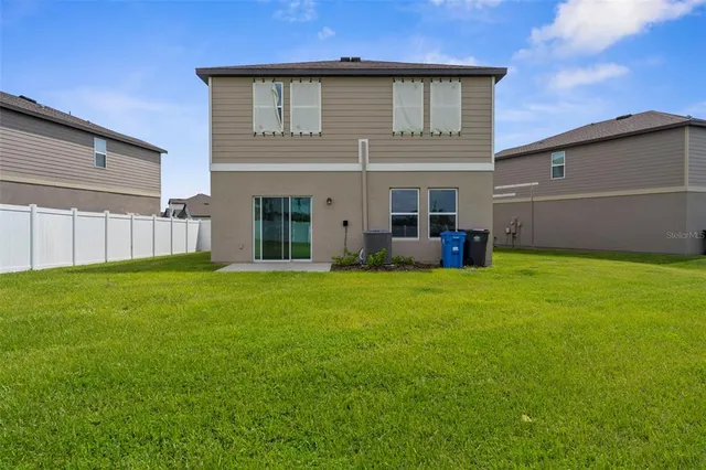 a view of a yard with a lake view
