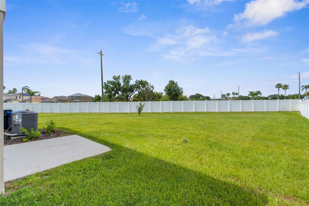 1038 Kelly Fern Loop Ruskin, FL 33570 - Photo 34 of 34 a view of a yard with a lake view